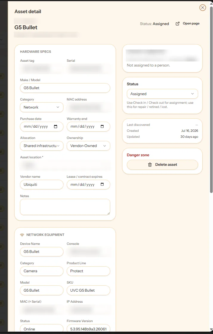 Asset detail: hardware specs, lifecycle and assignment state, and network fields on one record — identifiers blurred.